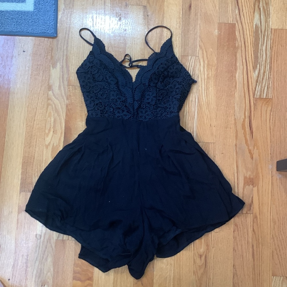 Lulus black romper. Cross-back adjustable straps with zip in lower back. Sz M